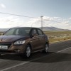 Photo dynamique sur route Peugeot 301 I Brun Rich Oak (2012)